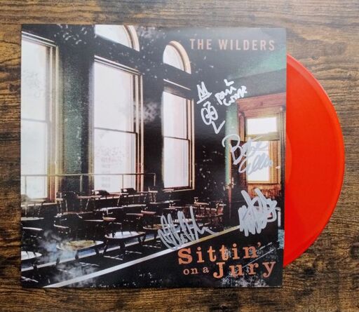 The cover and bright red record from The Wilders "Sittin on a Jury" album