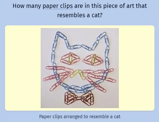 A screenshot of the game Estimate Me showing an arrangement of colored paper clips that resembles a cat